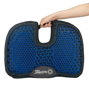 Wagan HealthMate blue gel seat cushion with cutout handle held by hand
