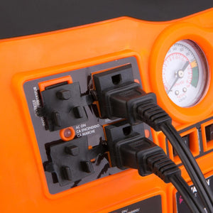 Two power cords plugged into AC outlets on an orange portable power station with a pressure gauge