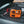 Wagan Tech orange portable jump starter connected to a car battery
