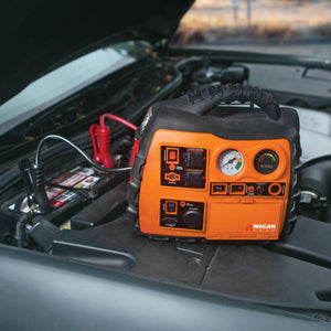 Wagan Tech orange portable jump starter connected to a car battery