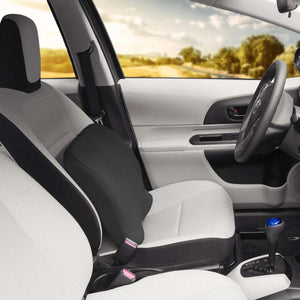 Black lumbar support cushion placed on a car seat