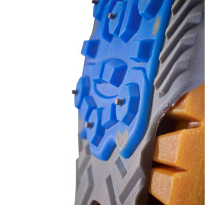 Winter Walking ice cleat sole with blue rubber traction pads and metal studs