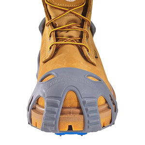 Winter Walking ice cleat attached to the toe of a tan work boot