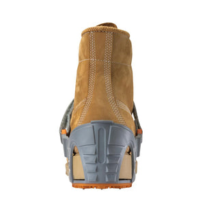 Winter Walking ice cleat attached to the heel of a tan leather work boot