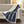 Woolrich plaid heated throw blanket with white sherpa lining draped over a sofa