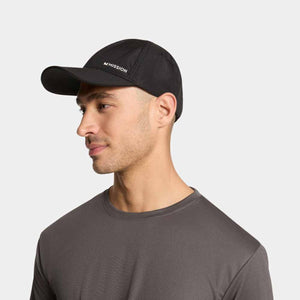 Man wearing a black Mission baseball cap