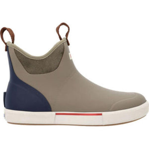 Tan and navy ankle rain boot with white rubber sole and brown pull tabs