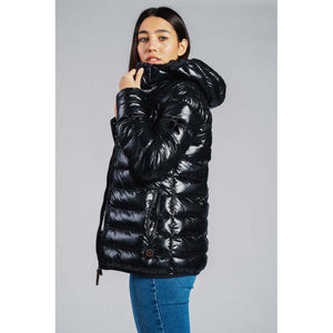 Woman wearing a black shiny hooded puffer jacket