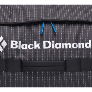 Black Diamond logo on black grid patterned fabric with blue zipper pulls