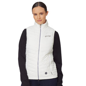 Woman wearing a white Venture Heat quilted vest over a black long sleeve shirt