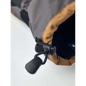 Hestra glove cuff with adjustable drawstring and toggle