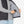 Person placing a Venture Heat battery pack into the interior pocket of a black heated vest