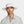 Man wearing a white Mission wide brim sun hat with a chin strap