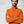 Man wearing an orange Fjallraven Abisko half zip fleece sweater with arms crossed