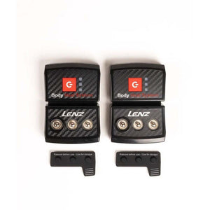 Two Lenz Body Heat System battery packs with snap connectors and storage caps
