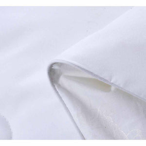Close up of white HealthyLine fabric showing texture and folded edge