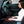 Person sitting in a car using a portable heated seat cushion