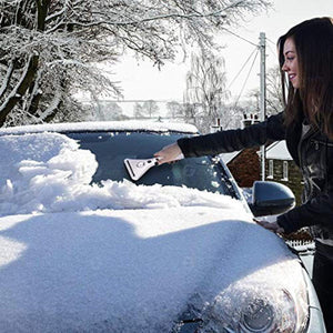 Person using a Zonetech ice scraper to clear snow from a car windshield